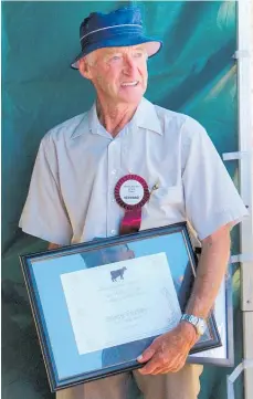  ?? ?? A slightly befuddled Bruce Pedley with the certificat­e celebratin­g his lifelong involvemen­t with Horowhenua’s AP&I Show.