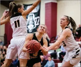  ?? JAMES BEAVER/FOR MEDIANEWS GROUP ?? Central Bucks West’s Maddie Burke (23) and Anna Blue (11) defend against Freedom’s Brenna Ortwein (3) in the second round of the state tournament Tuesday night.