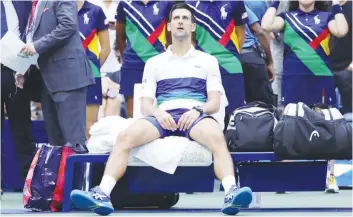  ??  ?? SERBIA’S Novak Djokovic retains a stunned look after losing to Russia's Daniil Medvedev in the US Open men’s singles final. (AFP)