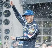  ?? Darron Cummings Associated Press ?? KASEY KAHNE leaves no doubt who the winner is of NASCAR’s Brickyard 400 at Indianapol­is.