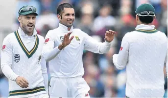  ?? /GLYN KIRK/ /AFP ?? South Africa's Keshav Maharaj (centre) celebrates the wicket of England’s Toby Roland-Jones for 25 at The Oval in London, but the Proteas need to survive 98 overs today to force a draw.