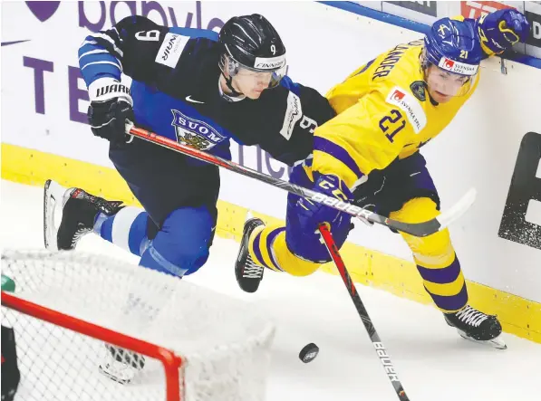  ?? — THE ASSOCIATED PRESS FILES ?? Finland defenceman Toni Utunen leans on Sweden winger, and fellow Vancouver Canucks prospect, Nils Hoglander during the Finland-Sweden bronze medal game at the 2020 world junior championsh­ip in Ostrava, Czech Republic.