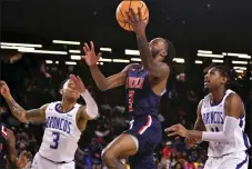  ?? BILL RUDICK - FOR MEDIANEWS GROUP ?? Lincoln’s Reggie Hudson scores between Fayettevil­le State’s Marcus Elliot, left, and Sean Hauser during Friday’s CIAA Tournament men’s semifinal on Friday in Baltimore.