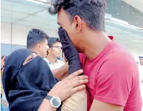  ??  ?? NO MORE TEARS, MY SON .... Noorjahan wipes tears off Hani’s eyes and shares her affection after meeting him at the Sharjah Internatio­nal Airport on Friday. (Right) Talha Shah greets Noorjahan.