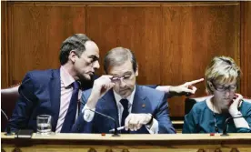  ??  ?? LISBON: Portuguese Prime Minister Pedro Passos Coelho (C) sits flanked by Portuguese vice prime minister Paulo Portas (L) and Portuguese finance minister Maria Luis Albuquerqu­e (R) during a debate at the Portuguese Parliament in Lisbon yesterday.