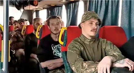  ?? Photo was taken from video released by the Russian Defense Ministry Press Service). Photo: (This Daily Mail ?? Headed for safety? Azov fighters, who had hoped to be freed in a prisoner swap, are taken by bus from the besieged plant