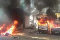  ?? PTI ?? Vehicles set on fire by protesters in Meerut on Monday. Cops fire teargas shells to disperse the protesters in Ranchi . —