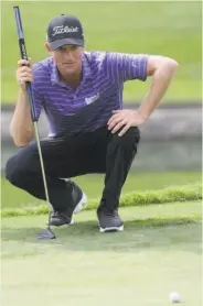  ?? LM Otero / Associated Press ?? Webb Simpson lines up a putt on the 18th hole. He finished the hole at 67 for a 9-under 201 score.