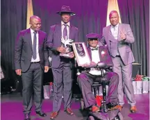  ??  ?? POPULAR: From left, ECPTA CEO Vuyani Dayimani, winners of won the best cultural and lifestyle award, Mfundo Dambisa and Mthombo Nkula, with MEC Oscar Mabuyane.