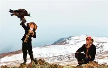  ??  ?? This image released by Sony Pictures Classics shows Aisholpan, left, and her father Nurgaiv in a scene from “The Eagle Huntress,” a documentar­y about a 13-year-old girl who trains to become an eagle hunter.