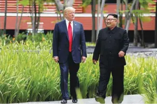  ?? - Reuters file photo ?? ELATED: US President Donald Trump and North Korea’s leader Kim Jong Un before their summit at the Capella Hotel on the resort island of Sentosa, Singapore.