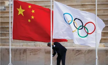  ?? Photograph: Alkis Konstantin­idis/Reuters ?? The Chinese and Olympic flags at the flame handover ceremony in Athens in October.