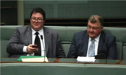  ?? Photograph: Mick Tsikas/AAP ?? George Christense­n and Craig Kelly. Government MPs say Kelly has been encouraged to once again avoid interviews.