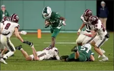  ?? MATT STONE — BOSTON HERALD ?? Billerica’s Dhaethmy Dorival gets some extra yardage against Chelmsford at Fenway Park. Dorival guided the Indians to a 27-13win on Wednesday night.