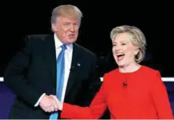  ??  ?? Trump shakes hands with Clinton at the conclusion of their first presidenti­al debate at Hofstra University in Hempstead, New York yesterday.