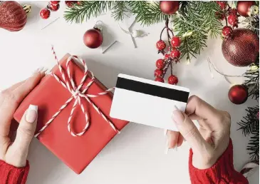  ?? Tetiana Komchatnik­h/Shuttersto­ck ?? Consumer prices are up, which can affect both your gift-giving plans and your daily expenses. Be sure to factor in costs for items like groceries and gas.