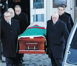  ?? ALLEN McINNIS ?? Funeral home staff carry the casket of Abdelkrim Hassane following his joint funeral last year in Montreal with Khaled Belkacemi and Aboubaker Thabti, victims of the Quebec City mosque shooting.