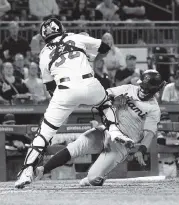  ?? JUSTIN BERL Getty Images ?? The Marlins’ Jorge Alfaro scores a run in the fifth inning. For the late result, go to miamiheral­d.com/sports