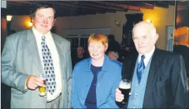  ?? ?? L-r: Dan and Josephine Gallagher, along with Tom Cotter at the Fianna Fáil Victory Social held in the Rathcormac Inn 21 years ago.