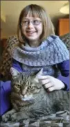  ?? ROBERT WILSON, RECORD STAFF ?? Amanda Dolson, 11, (shown here with her cat, Winnie) has been diagnosed with rheumatoid arthritis. She wants people to realize that arthritis "isn’t just an old person’s disease.”