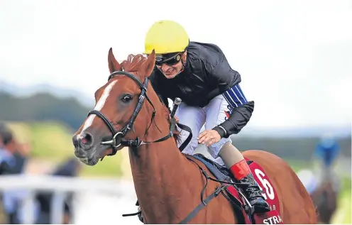  ?? Picture: PA. ?? Stradivari­us, ridden by jockey Andrea Atzeni, wins the Qatar Goodwood Cup Stakes.