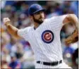  ?? THE ASSOCIATED PRESS FILE ?? Cubs starting pitcher Jake Arrieta throws against his old team, the Baltimore Orioles, in the first inning of a game in 2014.