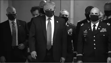  ??  ?? USA President wore a mask in public. This was during his visit tot wounded service members at Walter Reed. ( Photo: CNN)