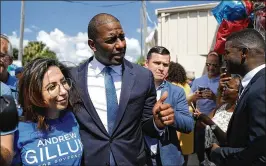  ?? JOE RAEDLE / GETTY IMAGES ?? Andrew Gillum, Democratic candidate for Florida governor, greets people at an Aug. 31 rally in Orlando. He faces ongoing questions on trips he took.