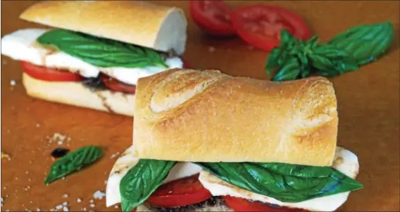  ?? PHOTO BY EMILY RYAN ?? This traditiona­l caprese sandwich includes mozzarella, but Catherine Renzi suggests her Goat-za-rella instead.