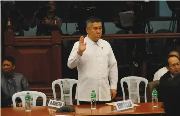  ??  ?? PROBE OF SHABU SHIPMENT CONTINUES: Trader Richard Tan, who owns Hong Fei Logistics where 604 kilograms of shabu were seized by government agents last May 26, takes his oath during the hearing of the Senate Blue Ribbon Committee chaired by Senator...