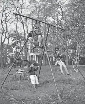  ??  ?? Robert F. Kennedy, top front, Edward M. Kennedy, left rear, and Jean Kennedy, right rear, play on a swing set in Bronxville, N.Y., in October 1934.