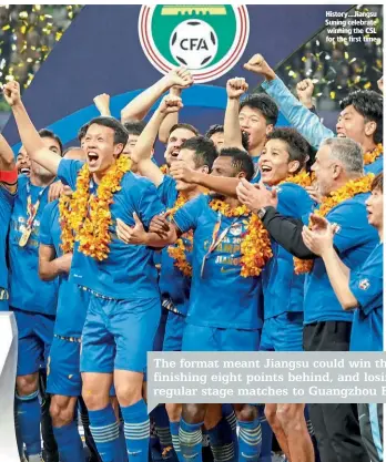  ??  ?? History…Jiangsu Suning celebrate winning the CSL for the first time