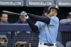  ?? CHARLIE RIEDEL — THE ASSOCIATED PRESS ?? Mariners’ Ichiro Suzuki bats during the third inning of a spring training game against the A’s in Peoria, Ariz., on Feb. 22.