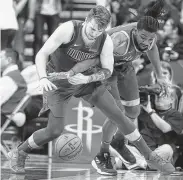  ?? Karen Warren / Staff photograph­er ?? The Rockets’ Kenneth Faried, right, has been a useful acquisitio­n in replacing Clint Capela.