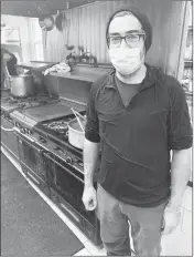  ?? PHOTOS BY MICHAEL BORIERO ?? François Lemieux stands in the Chaudronné­e de l’estrie kitchen after completing another lunch service.