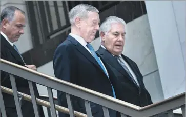  ?? Brendan Smialowski AFP/Getty Images ?? DEFENSE SECRETARY James N. Mattis, center, and Secretary of State Rex Tillerson, right, prepare to meet with senators this month. Both Mattis and Tillerson have advocated diplomacy with North Korea.