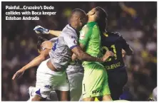  ??  ?? Painful...Cruzeiro’s Dede collides with Boca keeper Esteban Andrada