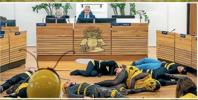  ??  ?? Protesters playing dead bees attend Christchur­ch City Council’s draft annual plan submission hearings in June last year, to challenge the council plan to start using glyphosate again.