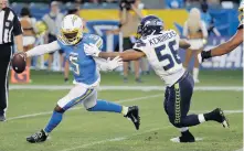  ?? ALEX GALLARDO/ASSOCIATED PRESS ?? Former Hampton High and Virginia Tech quarterbac­k Tyrod Taylor was the Chargers’ leading rusher in a 23-15 loss to Seattle, with 34 yards on six carries.