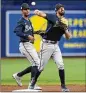  ?? CHRIS O’MEARA/ASSOCIATED PRESS ?? Braves infielder Braden Shewmake (right) has been performing well on defense and tripled Monday.