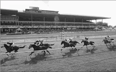  ?? BILL DENVER/EQUI-PHOTO ?? An issue yet to be resolved is how to handle wagers when a race is switched from turf to dirt.