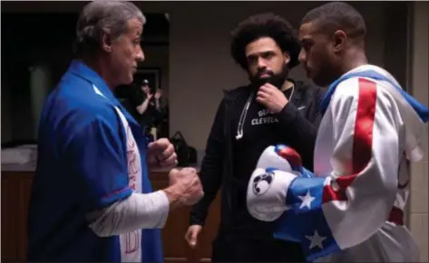  ?? PHOTOS COURTESY OF METRO GOLDWYN MAYER PICTURES AND WARNER BROS. PICTURES ?? Director Steven Caple Jr., center, talks to “Creed II” stars Sylvester Stallone and Michael B. Jordan during the movie’s shoot.