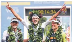  ?? FOTO: DAVID PINTENS/DPA ?? Jubel bei der Ironman-WM auf Hawaii 2019 (l-r): Tim O‘Donnel aus den USA, Sieger Jan Frodeno und Sebastian Kienle aus Deutschlan­d.