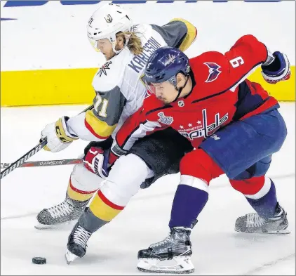  ?? AP PHOTO ?? Vegas Golden Knights forward William Karlsson, left, and Washington Capitals defenceman Dmitry Orlov battle for the puck during Monday’s Game 4 of the Stanley Cup final in Washington.