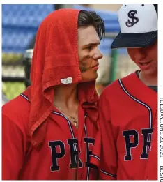  ??  ?? COOL: A St. John’s Prep player uses a towel to beat the heat Monday in Sudbury.