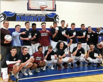  ?? MIKE STRIBL — DAILY FREEMAN ?? Members of the New Paltz High School boys basketball team pose for photos after winning the Section 9, Class A championsh­ip.