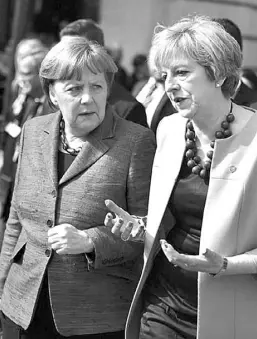  ??  ?? Infructífe­ra reunión entre Merkel y May. Redes