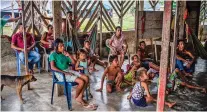  ?? FEDERICO RIOS ESCOBAR/NEW YORK TIMES ?? Colombians displaced by fighting watch a movie at a camp in Juan Jose, Colombia. Violence is soaring in the countrysid­e, and the government is wavering in its commitment to the peace deal reached in September 2016, issuing new orders that officers fear may risk civilian lives.