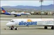  ?? AP FILE ?? Two Allegiant Air jets are shown at McCarran Internatio­nal Airport in Las Vegas in May 2013.