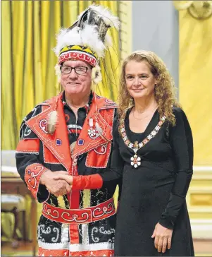  ?? CP PHOTO ?? Julie Payette, Governor General of Canada, presents the Order of Canada to Chief Terry Paul of Membertou, at Rideau Hall in Ottawa on Friday.